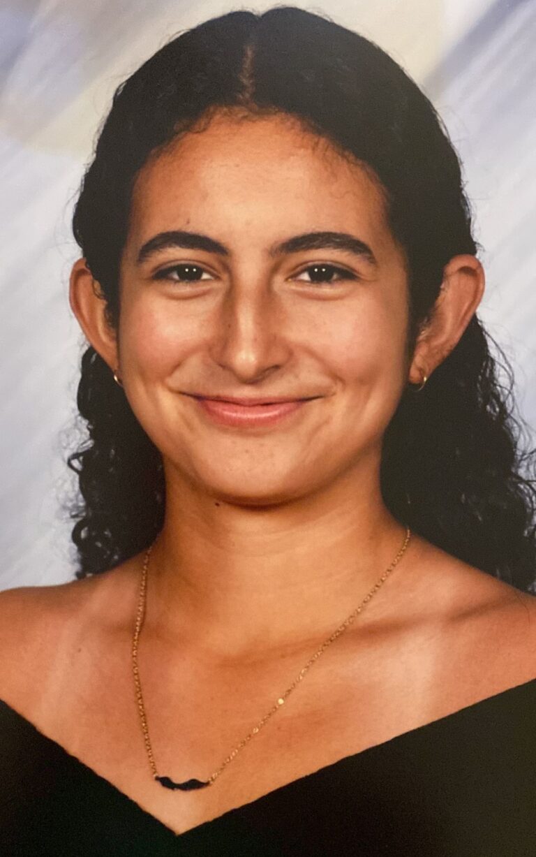 Gibelle Beaujon takes her graduation photo for her high school diploma. She becomes a management student-athlete at Salisbury University.